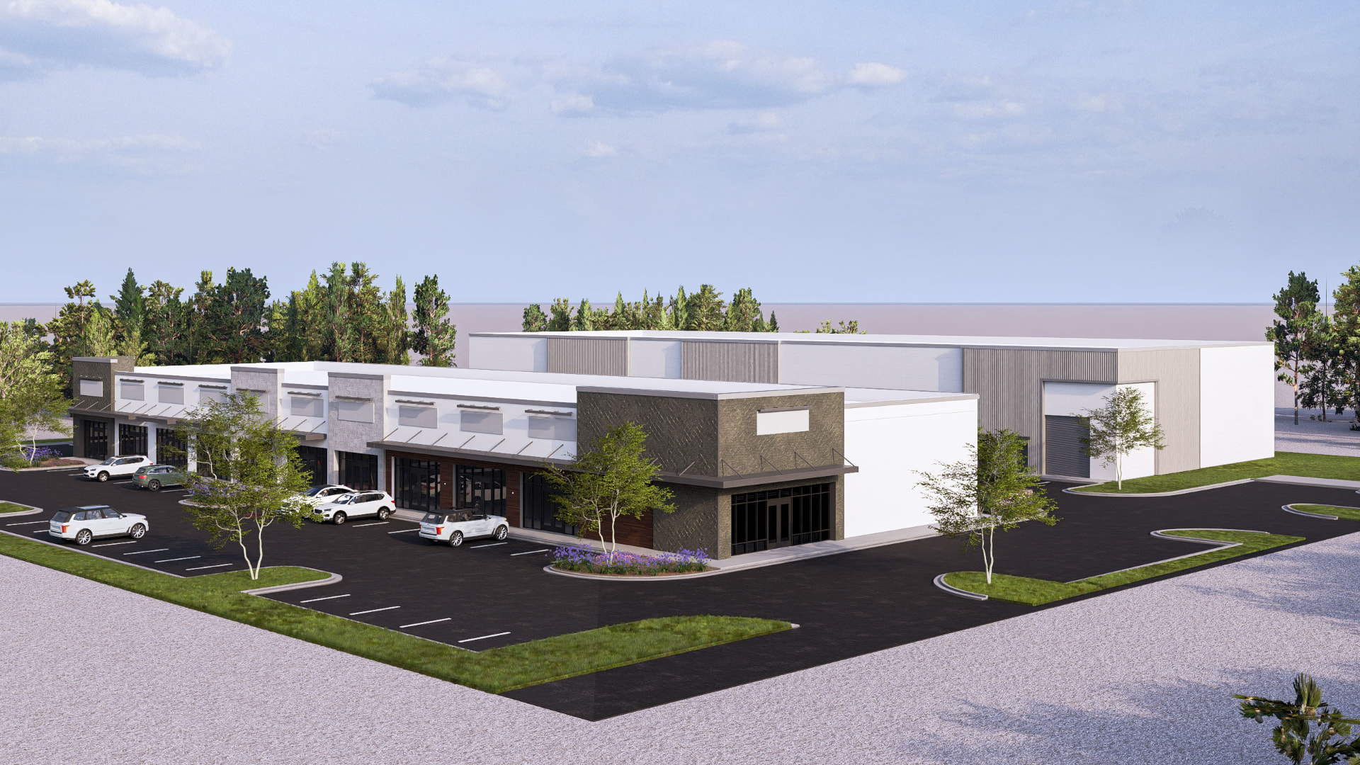 Aerial view of Spencer Plaza site, parking field, and rear warehouse building